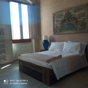 A bed or beds in a room at Al Console Le Dimore Apartment