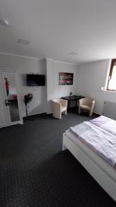 Postel nebo postele na pokoji v ubytování Hotel & Restaurant - Zum Schleicher Kuckuck