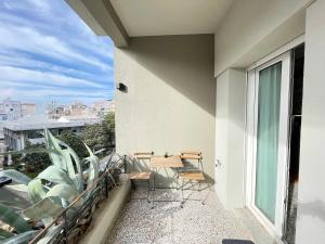 a balcony with chairs and a view of a city at 19 Living in Komotini