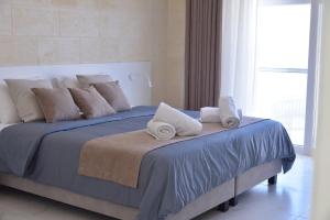 Katil atau katil-katil dalam bilik di San Pawl bnb farmhouse CALYPSO