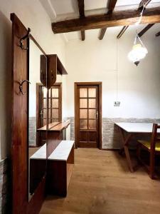 a room with a table and a bench in a room at Perla Azzurra - Forte dei Marmi - Cinque Terre in Montignoso