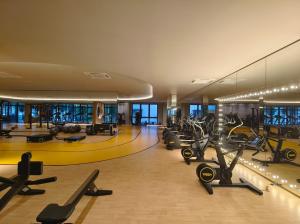 a gym with a bunch of exercise bikes in it at M-Vertica Sunway Velocity Cheras by Luvit Stay in Kuala Lumpur