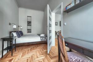 Ένα ή περισσότερα κρεβάτια σε δωμάτιο στο MARGI Joy Apartament Cozy in The City Centre