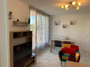 Χώρος καθιστικού στο Chambres ou Appartement Cosy