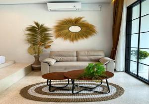 a living room with a couch and a table at Sampai Villa Teras Breksi in Randugunting