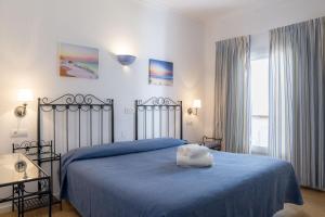 Posteľ alebo postele v izbe v ubytovaní Hostal Alemania