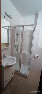 a bathroom with a shower and a sink at Casa vacanze Mare Monti in Grottammare +10 photos