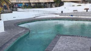 a large pool of water in a building at Beach LOFT Tabaiba in Tabaiba