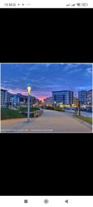 a picture of a street with buildings in the background at Apprtmt jury de luxe in Nador