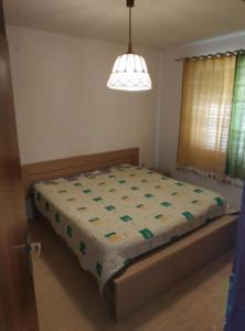 a bedroom with a bed in a room at Apartment Zaglav 3 - first sea row in Zaglav +13 photos