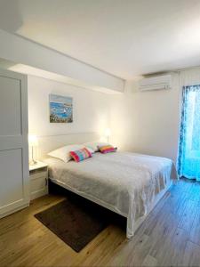 Postel nebo postele na pokoji v ubytování Apartment in Casa Porta Luna, Gajac, Novalja