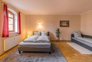 Katil atau katil-katil dalam bilik di Stadtgut Mölkau Apartment