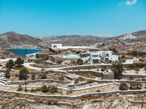an aerial view of a resort on a mountain at On The Rocks - The Pebbles - Serviced Villas in Ios Chora