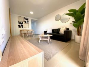 a living room with a couch and a table at VV Canary Islands 1 in San Miguel de Abona
