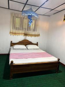 Postel nebo postele na pokoji v ubytování Misty heaven diyathalawa