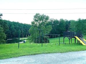 a park with a playground with a slide at Mountainside Cabin, Secluded, Hot Tub, Lake Accessible in Rockbridge