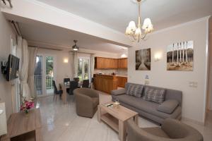 a living room with a couch and a table at Villa Agrilida in Vasiliki