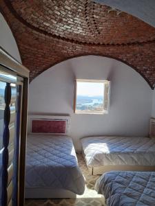 Postel nebo postele na pokoji v ubytování Mashamman nuban house