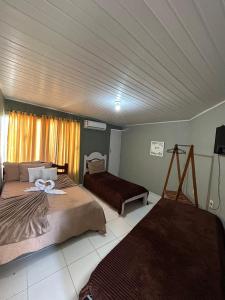 Postel nebo postele na pokoji v ubytování Pousada Caribe do Frances