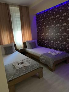 Postel nebo postele na pokoji v ubytování Apartmani CENTAR- Smederevo