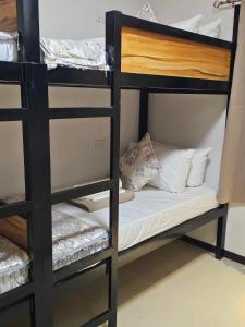 Postel nebo postele na pokoji v ubytování JaiJai's Backpackers Inn