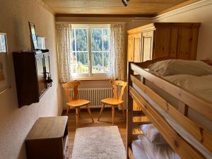 Postel nebo postele na pokoji v ubytování Chalet Im Wieselti