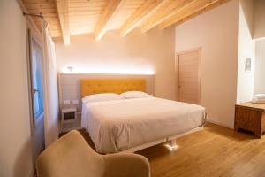 Postel nebo postele na pokoji v ubytování Residenza Ai Capitelli + 37 fotografií