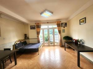 Postel nebo postele na pokoji v ubytování Đà Lạt Chay Guest House