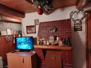 TV a/nebo společenská místnost v ubytování Vila Lara
