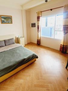 Postel nebo postele na pokoji v ubytování Đà Lạt Chay Guest House