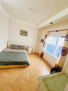 Postel nebo postele na pokoji v ubytování Đà Lạt Chay Guest House