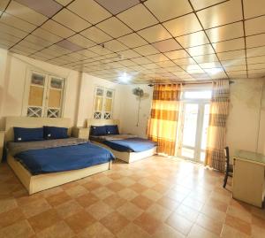 Postel nebo postele na pokoji v ubytování Đà Lạt Chay Guest House