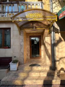 a entrance to a building with a door at Hotel MERIDA in Blagoevgrad +93 photos