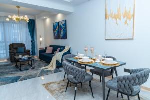 a dining room and living room with a table and chairs at Paradise Haven in Nairobi