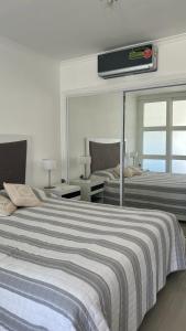 Postel nebo postele na pokoji v ubytování Green Park Apartamento de 1amb en 2do piso Vista Laguna