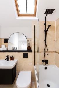 a bathroom with a sink toilet and a mirror at Luxury two bed inc hot-tub in Harrogate +29 photos