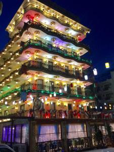 a large building with lights on it at night at Marko Paşa Konağı in Kusadası