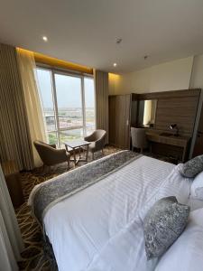 Postel nebo postele na pokoji v ubytování Rafid Hotel Jazan - فندق رفيد جازان