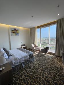 Postel nebo postele na pokoji v ubytování Rafid Hotel Jazan - فندق رفيد جازان + 27 fotografií