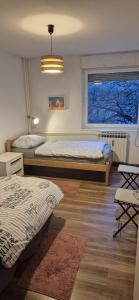 Postel nebo postele na pokoji v ubytování Apartment Jarun Comfort