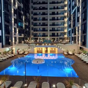 a large pool in the middle of a building at Mamaia Nord Resort Premium in Mamaia Sat/Năvodari