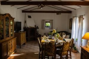 a dining room with a table and a couch at Ranczo Stare Objezierze in Moryń