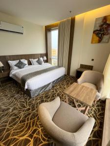 Postel nebo postele na pokoji v ubytování Rafid Hotel Jazan - فندق رفيد جازان