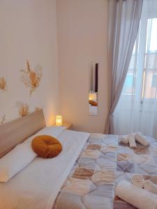 Postel nebo postele na pokoji v ubytování F.A.M. ROOMS
