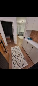 a view of a living room with a room with a floor at M&E Prishtina apartment in Prishtinë