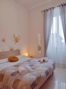 Postel nebo postele na pokoji v ubytování F.A.M. ROOMS