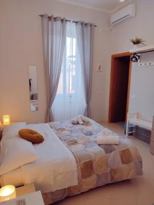 Postel nebo postele na pokoji v ubytování F.A.M. ROOMS