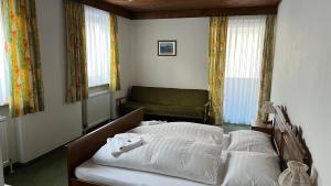 Postel nebo postele na pokoji v ubytování Haus Alpina by Châtel Reizen