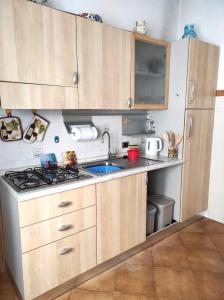 a kitchen with a sink and a stove at Al Parchino in Arezzo +22 photos