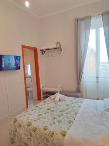 Postel nebo postele na pokoji v ubytování F.A.M. ROOMS